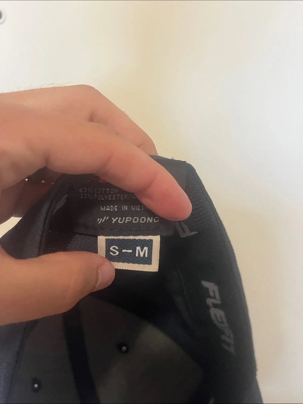 Travis Mathew Navy Blue Baseball Cap with Brown Hex Patch